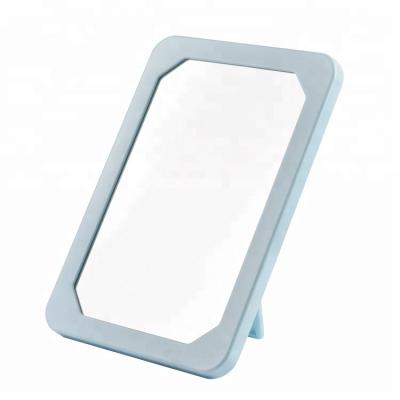 China Factory Price Single Side Plastic Self Magnifying Small Vanity Standing Makeup Mirror for sale