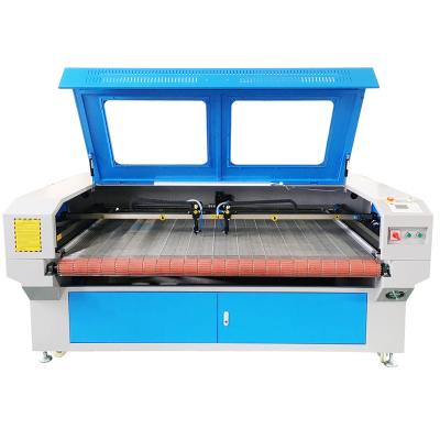 China Laser CUTTING Automatic Feeding Leather Fabric CO2 Double Head Laser Cutting Machine 1600*1000mm for sale