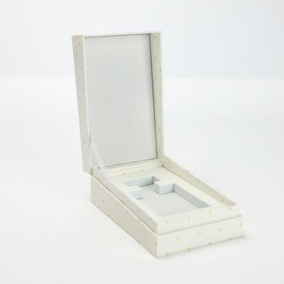 China Custom Elegant Rigid Cardboard Recycled Cosmetic Paper Box Materials Flip Top Perfume Packaging White for sale