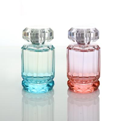 China OEM Style Round 100ml Custom Blue Glass Perfume Empty Spray Pump Bottle With Acrylic Cap for sale