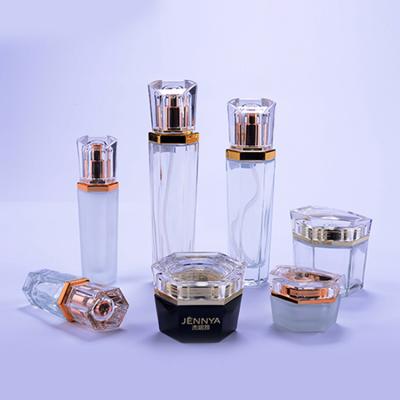 China OEM Style Custom Luxury Cosmetic Set Glass Packaging High End Lotion Pump Bottles Empty Cream Jars With Acrylic Cap for sale