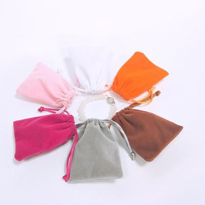 China Elelgent 2022 New Logo Exquisite Velvet Jewelry Bag Drawstring Pouch Small Storage Bag Custom Jewelry Packaging Bags for sale