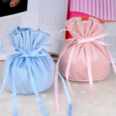 China 2022 Elelgent Free Sample New Factory Style Jewelry Packaging Pouch Round Shape Drawstring Gift Velvet Bottom Bag for sale