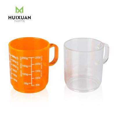 China Sustainable Durable Material Plastic PS Measuring Cup With Handles for sale