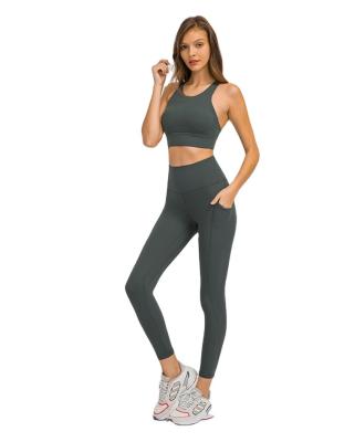 China FANMEIFEI 2021 High Quality Custom LOGO Women Breathable Yoga Pants Side Pockets Buttocks Slimming Sports Fitness Running Pants for sale