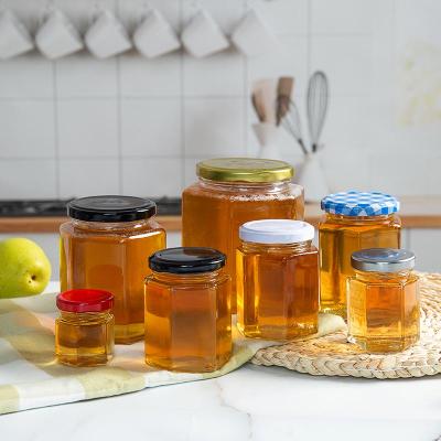 China High Quality Luxury Hexagon Food Storage Empty Metal Honey Jar With Glass Lid for sale