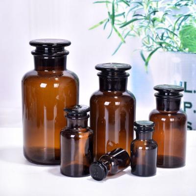 China 30ml Viable 60ml 125ml 250ml 500ml 1000ml Amber Hapothecary Reagent Glass Bottle With Glass Stopper for sale