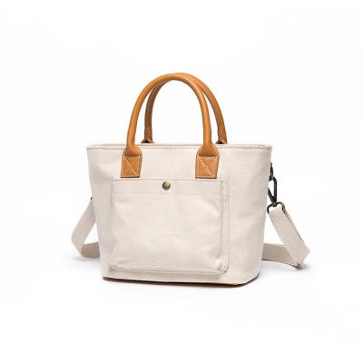 China Water Resistant Fashion Designer Handbag Women Summer Canvas Bag Luxury Leisure Bicolors Tote Bag for sale