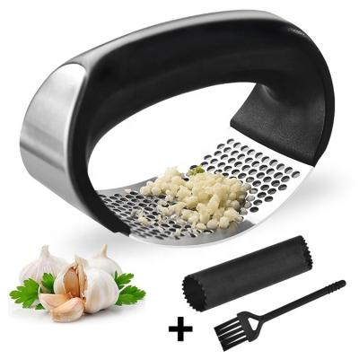 China Kitchen Tools and Instruments Metal 304 Stainless Steel Rocker Rocker Garlic Crusher Viable Garlic Press for sale