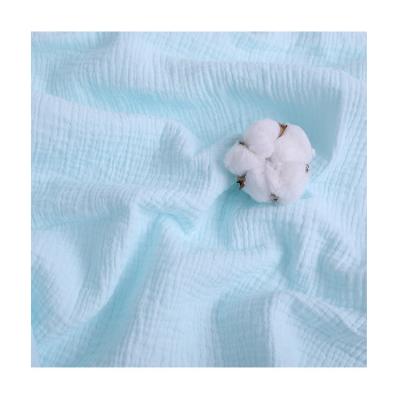 China Memory Wholesale 100% Cotton Baby Muslin Muslin Fabric Double Ply Solid Color Single Dye For Pajamas Bibs Wraps for sale