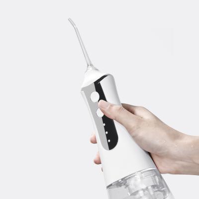 China Car Dental Oral Irrigator IPX7 Waterproof Portable Cordless Electric Tips 4 Nozzle for Teeth Cleaning Water Flosser for sale