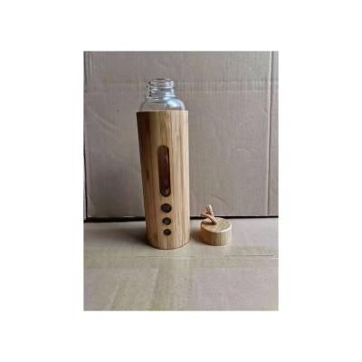 China Manufacturer Wholesale Glass High Borosilicate Sustainable Home Office Travel Water Bottle With Wooden Bamboo Lid for sale