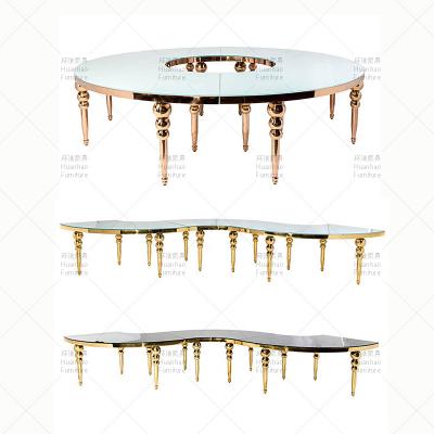 China Modern Factory Event Decoration MDF Moon Table Stainless Steel Gold Mirror Royal Glass Wedding Serpentine Table for sale