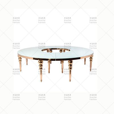 China Modern wedding s shape wedding event furniture gold royal stainless steel frame glass top dining table for sale