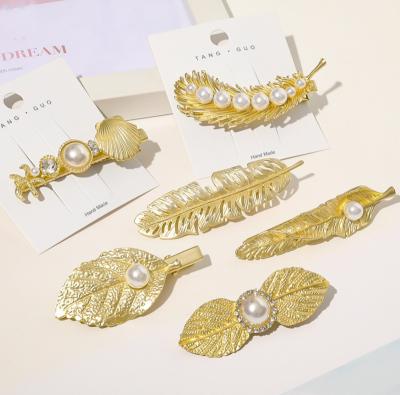 China New Metal Shell Hairpin Alloy Under Gold Duck Leaf Bill European Popular Pearl Hairpin Hot Style Leaf Bangs Cut for sale