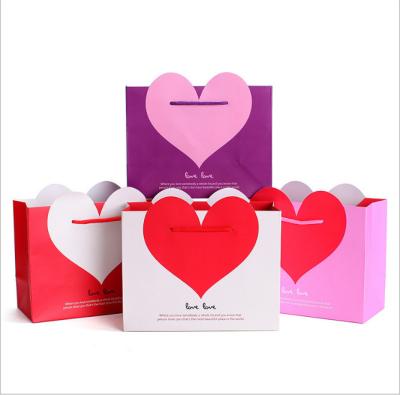 China Factory Direct Wholesale Recycled Materials Ready To Ship Heart Shape Gift Bags Custom Logo Mini Gift Bags Bag For Gift for sale