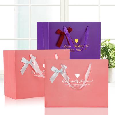 China Recycled Materials Factory Direct Luxury Printed Gift Paper Bag Custom Buying Wedding Favors Bag With Your Own Logo for sale