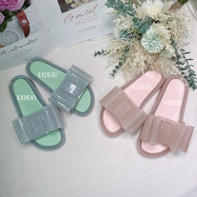 China Disposable Comfortable Luxury Korean Colorful Pretty Bow Jelly Shoes Women Flat Clear Sandal for sale