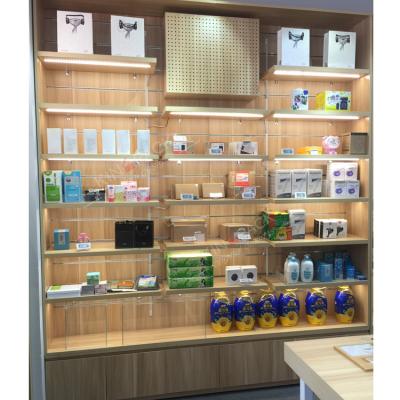 China Modern And Fashion Wooden Cosmetics Cabinet Display Round Product Showcase Shelf for sale