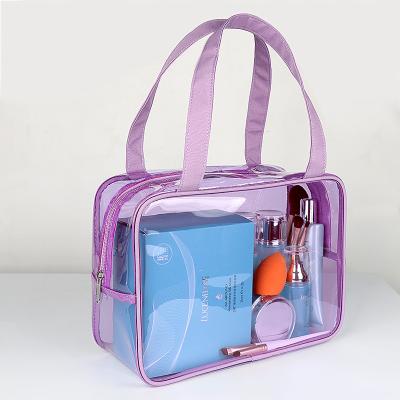 China Plastic PVC Waterproof Portable Clear Zipper Make Up Transparent Toiletry Bag Cosmetic Bag Travel Bag With Both Handle for sale