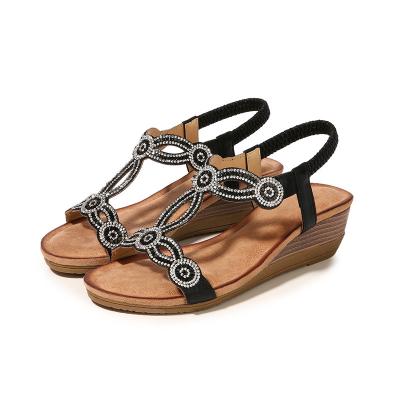 China Fashion Trend New Style Ladies Hollow Out Rhinestone Round Toe Bohemian Sandals Casual Wedge Platform Sandals for sale