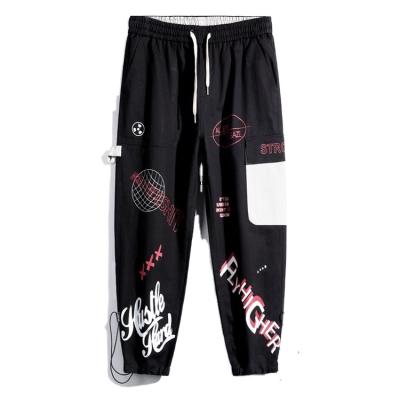 China Anti-wrinkle spring graffiti printing cargo pants for logo men 2021 popular Straight-leg luggage pants loose for sale