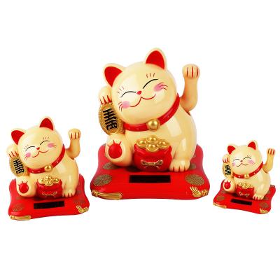 China Small size 2.5inch Japan Maneki Neko feng shui porcelain fortune miniature plastic lucky cat arm solar powered waving figurines for sale