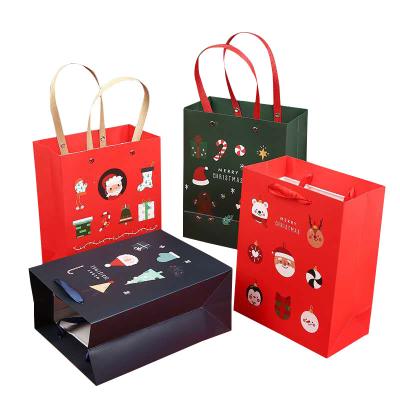 China Recyclable Custom Kraft Paper Printed Merry Christmas Shopping Gift Bag With Customized Logo for sale