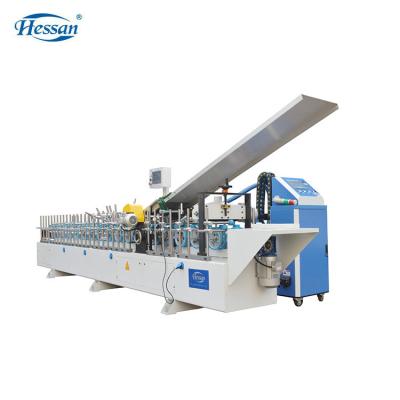 China Hotels Guangzhou Hessan Profile Wood Wrapping Machine For Veneer And PVC for sale