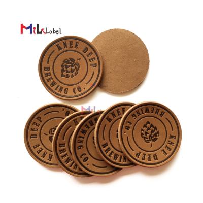 China Wholesale washable custom design genuin leather patches with hot stamping genuine leather labels for hat bags shoes clothes jacket for sale