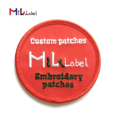 China Handmade iron on patches embroidery patch custom embroidered patches for clothing with iron on backing and merrowed border for sale