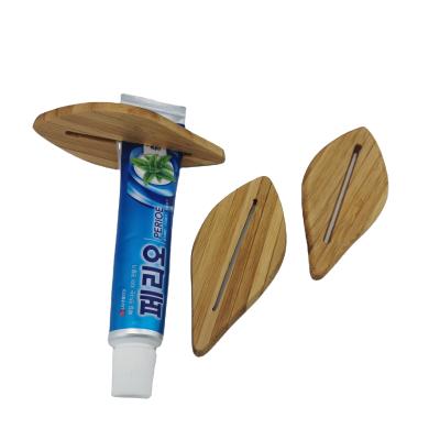 China Sustainable Sustainable Sustainable Bamboo Squeeze Toothpaste Squeezer Toothbrush DISPENSER for sale