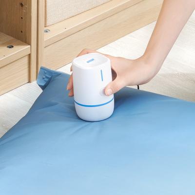 China Automatic Mini Great High Quality Vacuum Family Homes Compression Storage Portable Blue Bag Vacuum Electric Hand Pump for sale