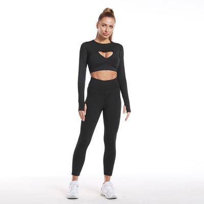 China Breathable Women's Long Sleeved Yoga Set Tracksuit 3 Piece Round Collar Cutout Top And Bra And Tight Pants Set for sale