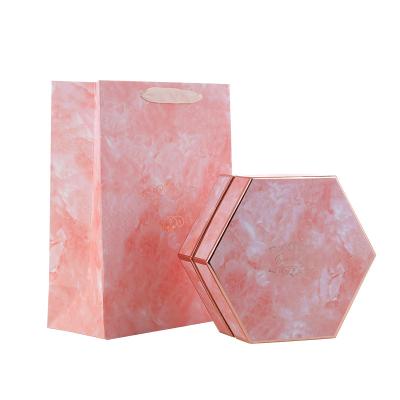 China Recycled materials wholesale custom exquisite hexagonal gift box valentines gift packaging box with paper bag for sale