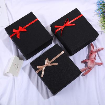 China Recycled materials valentine gift box high end luxury black perfume lipstick gift packaging box with ribbon for sale