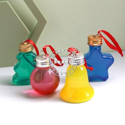 China Creative Plastic Beverage 50ML Juice Drink Bottle Christmas Tree Bell Star Ball Bulb Shaped Bottle With Lid for sale