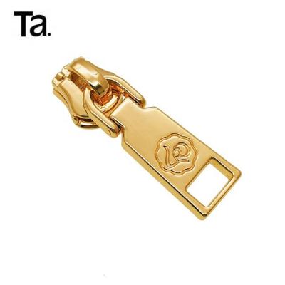 China TANAI Eco-Friendly New Style Rose Designer Fashion Engrave Logo Metal Zipper Slider Pull for sale