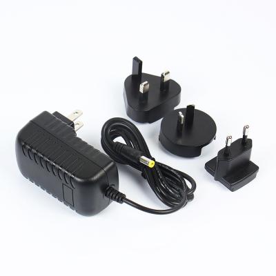 China Interchangeable 12V2A Currency Wall Socket AC/DC Plug Power Adapter 24W for sale