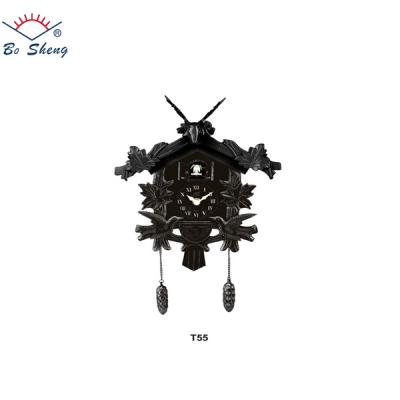 China Antique style black color cuckoo wall clock with bird come out fashion wall clock wholesale wall clock for sale