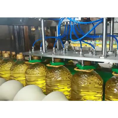 China Factory Automatic High Speed ​​Pet Oil 2l 3l 5 Liter 10l Bottle Neck Grip Ring Lift Inserting Applicator Plastic Pressing Machine for sale