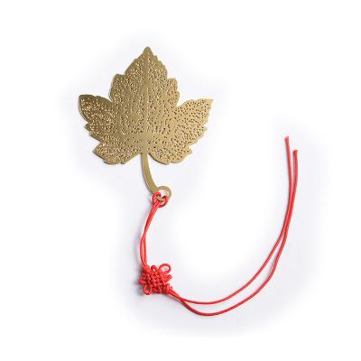 China Promotional Engraved Metal Bookmark Gold Maple Leaf Hollow Out Design for sale