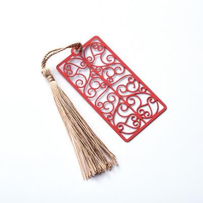 China Red Spray Hollow Fancy Engraved Metal Bookmark With Tassel Different Shapes for sale