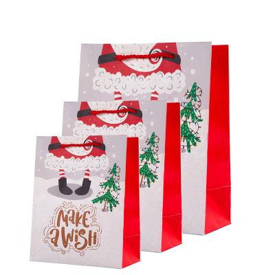 China Handmade Luxury Red White Drawstring Christmas Gift Paper Bag Cardboard Large For Gift for sale