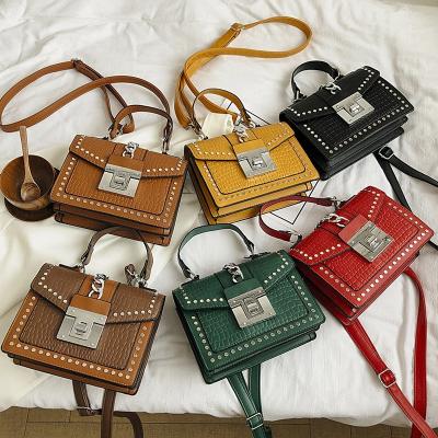 China Portable Designer Purses Crocodile Pattern Luxury Cross - Body Ladies Handbags Rivet Famous Brand Mini Handbag For Women for sale