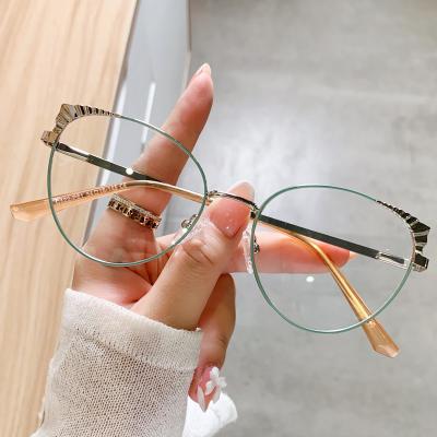 China 2022 Newest Fashion Colorful Design Blockling Women Computer Glasses Cat Eye Glasses Frame Blue Light Glasses For Women WH513 for sale