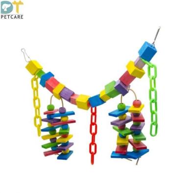 China Stocked Medium And Large Parrot Toy Chewing Toy Block Colorful Wooden Plastic Chain Soft Bridge for sale