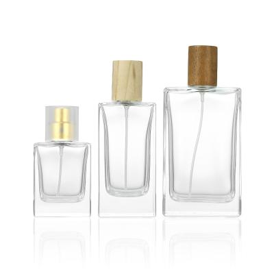 China New Design Perfumes Bottle 30ml 50ml 100ml Square Cosmetic Luxury Clear Flat Spray Glass Bottle for sale