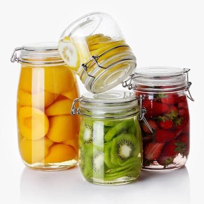 China Minimalist Wholesales Wide Mouth Mason Jar Glass Bottle With Flip Top Cap Storage Glass Jar With With Metal Clip for sale