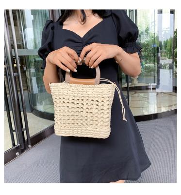 China Cross 2021 - Body Bags Straw Handbag Woven By Hand Made Drawstring Straw Beach Bags Casual Handbags Ladies Tote Fashion Designer for sale